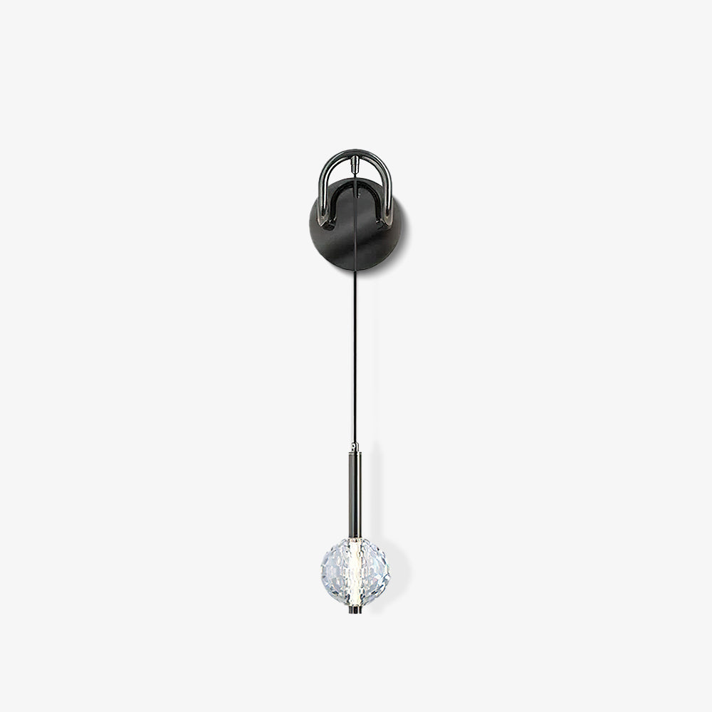 Isolated front view of loop-arm wall fixture, thin suspension and faceted glass globe against white background