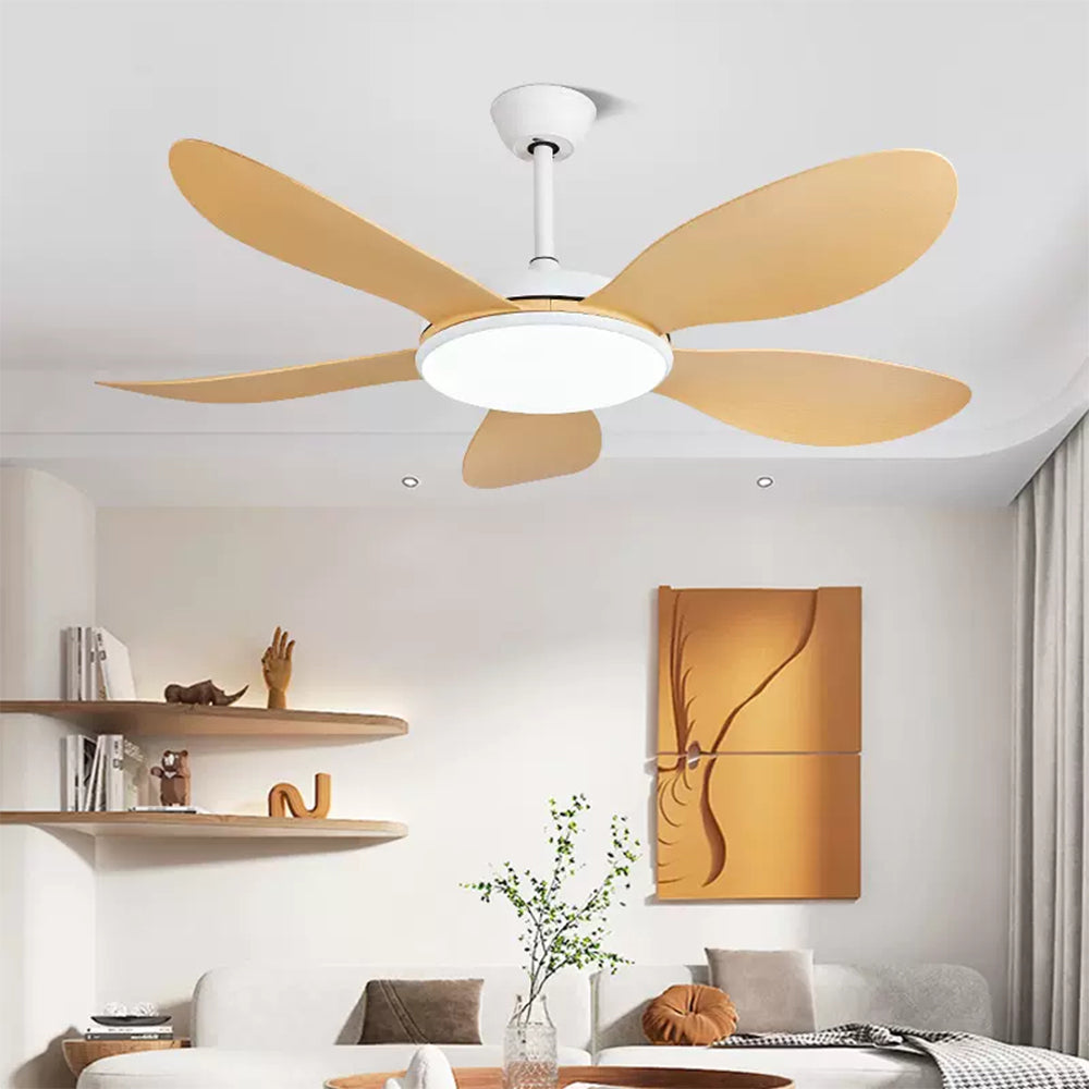 Woodgrain curved-blade fan with circular light above a cream sofa, wood shelves and orange wall art