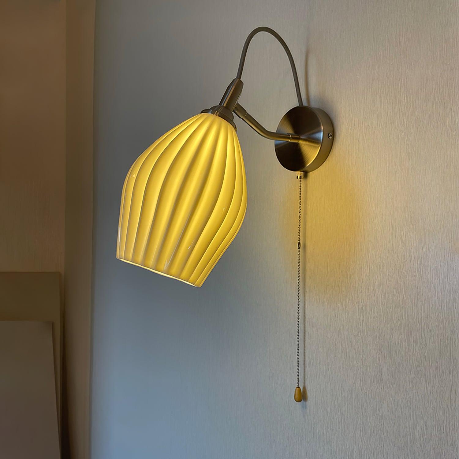Gallery view of a glowing ceramic shade with a pull chain