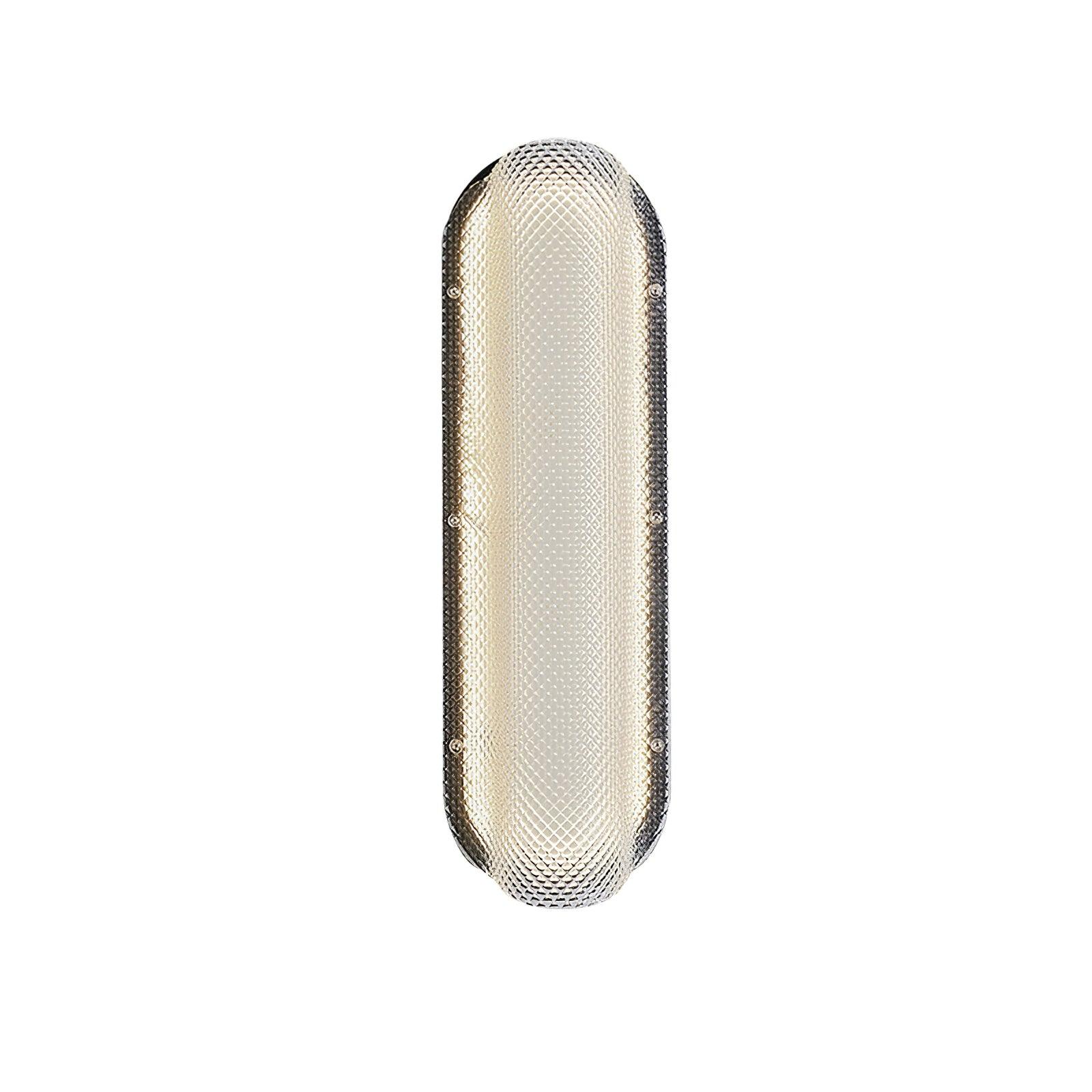 Farther front view of the lit Vale glass wall light with a textured capsule outline on white