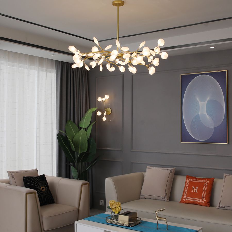 Olivia gold chandelier above a sofa and coffee table