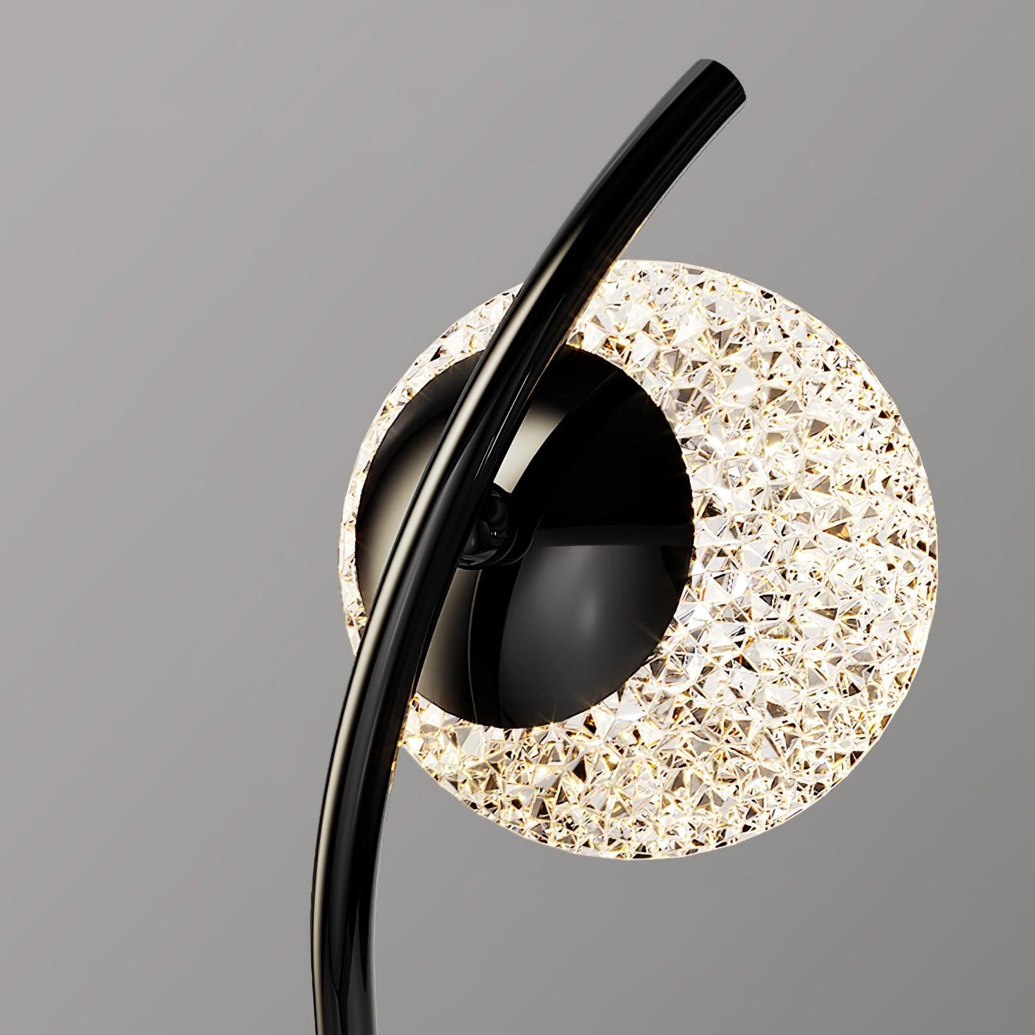 Close view of faceted ring behind the curved Black stem