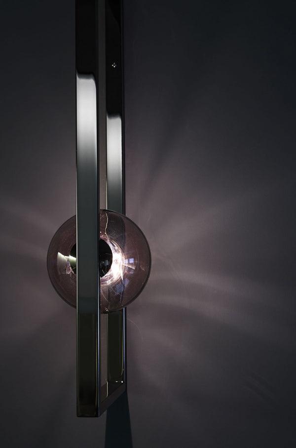 Vertical Black frame with dark globe and reflected light