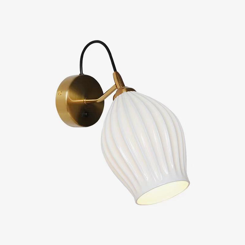 Angled white ceramic shade on a gold-coloured arm