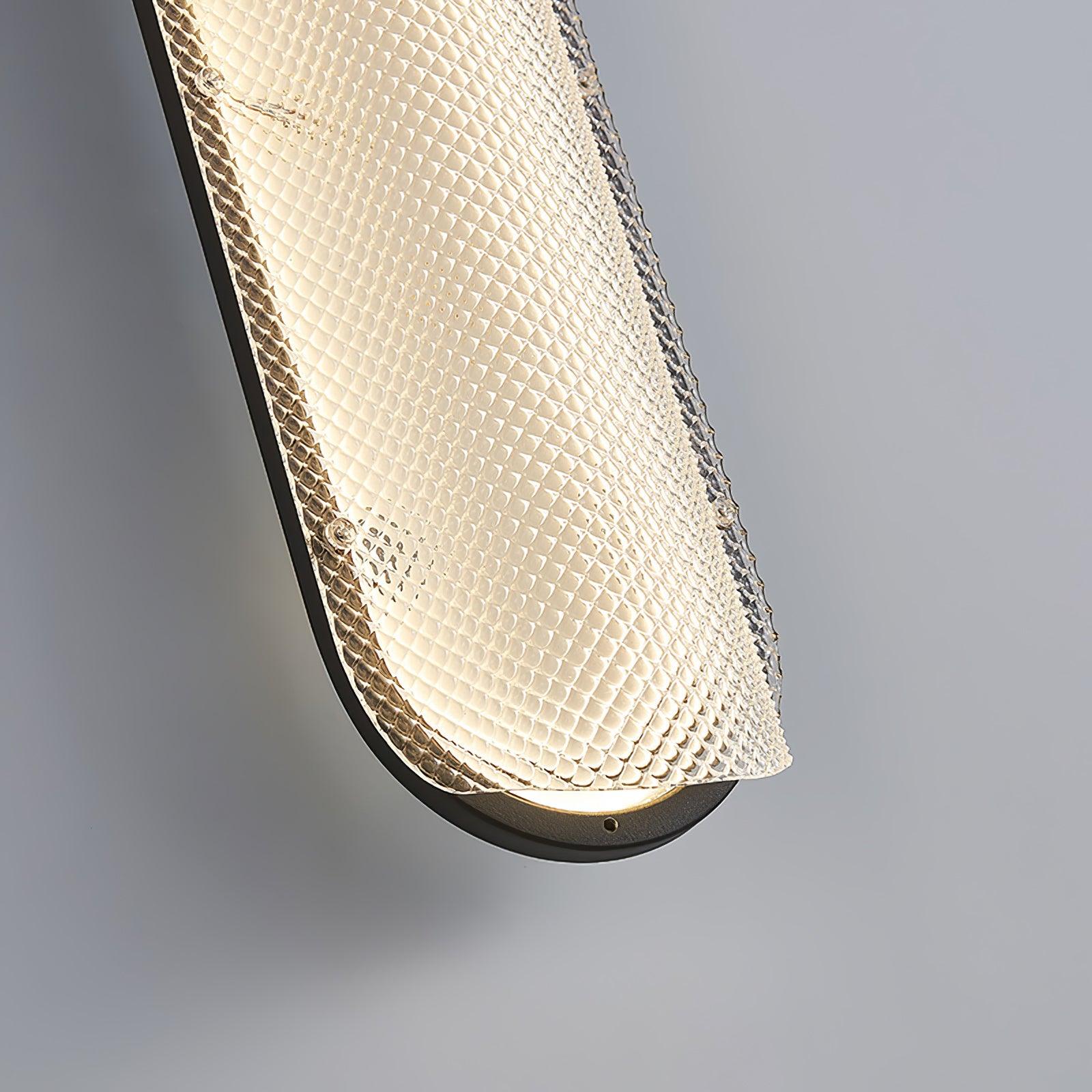 Close lower end of the textured glass lens, side fixings and rounded black backing