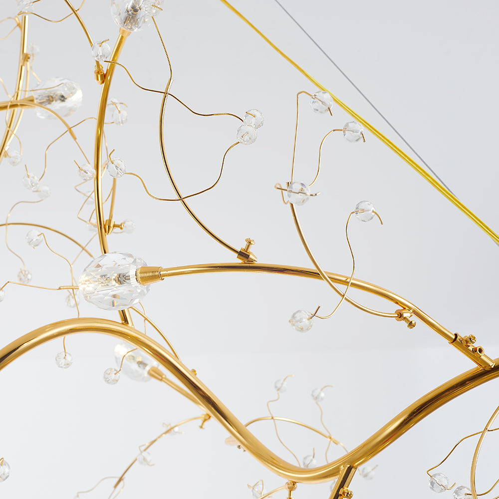 Close view of clear ornaments on Olivia gold-tone branches