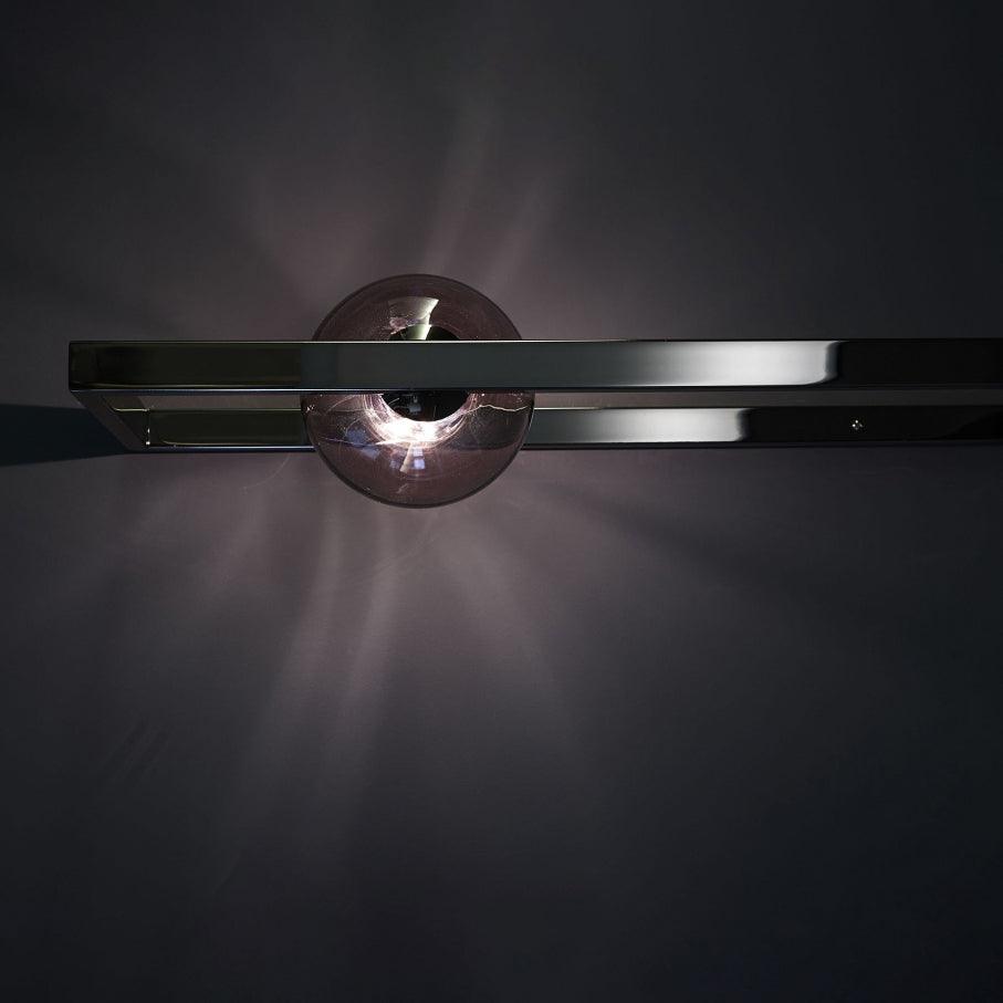 Horizontal black rectangular frame with an offset dark reflective glass globe