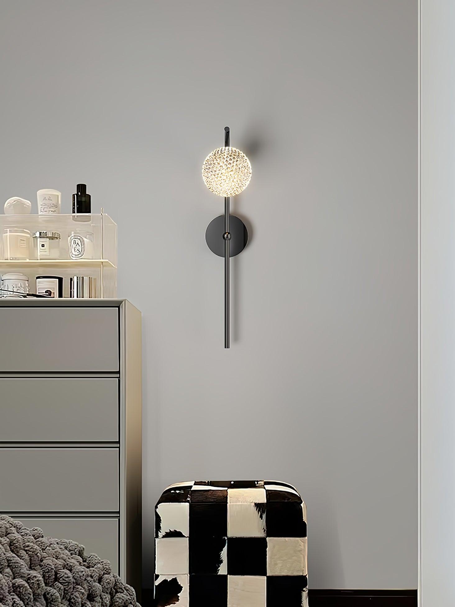 Black round-head lamp beside an indoor cabinet