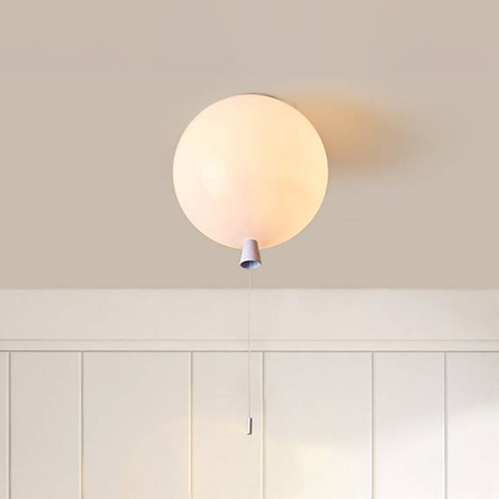 White Fateh balloon fitting glowing at a pale ceiling above white vertical wall panels, with a tapered detail and thin hanging string.