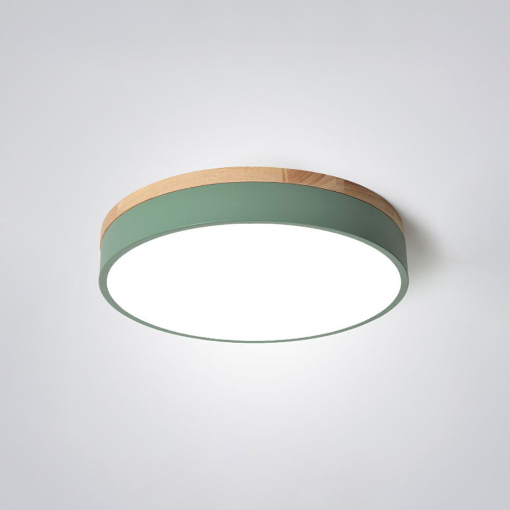 Angled close view of Morandi with a green side band, wood-tone upper trim and bright circular lower face.
