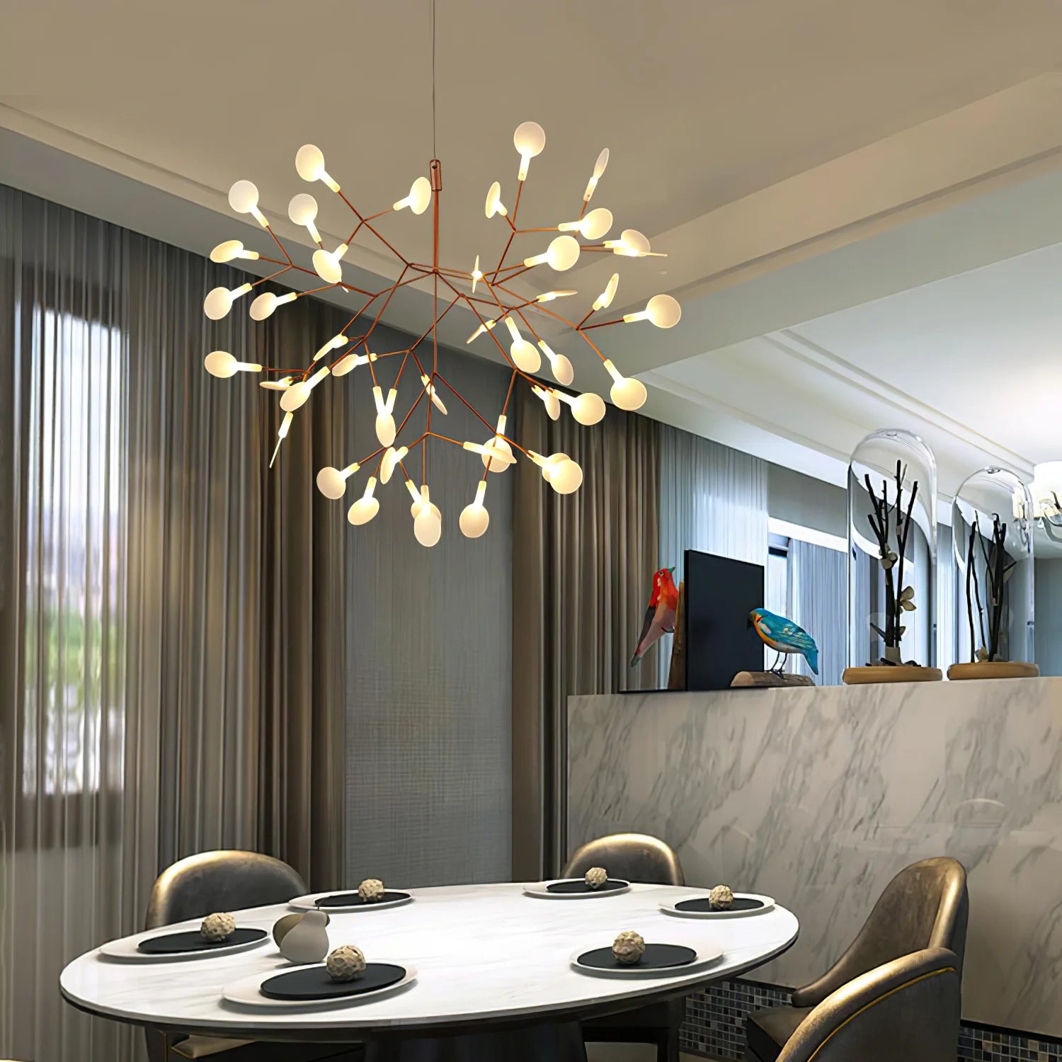 Rose-colour firefly chandelier over a dining table
