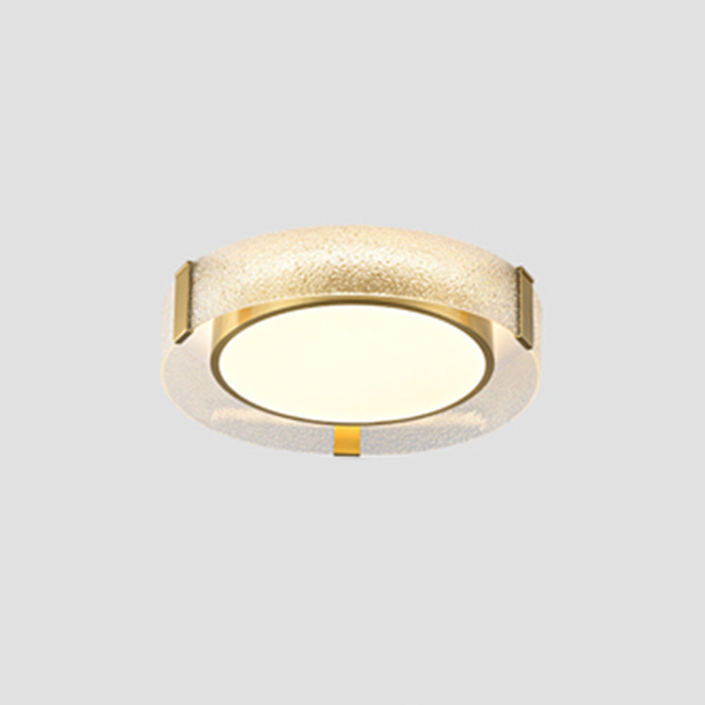 Smaller isolated Quinn on a grey background, with pale warm-looking disc, gold-tone rim and visible supports across the textured glass band.