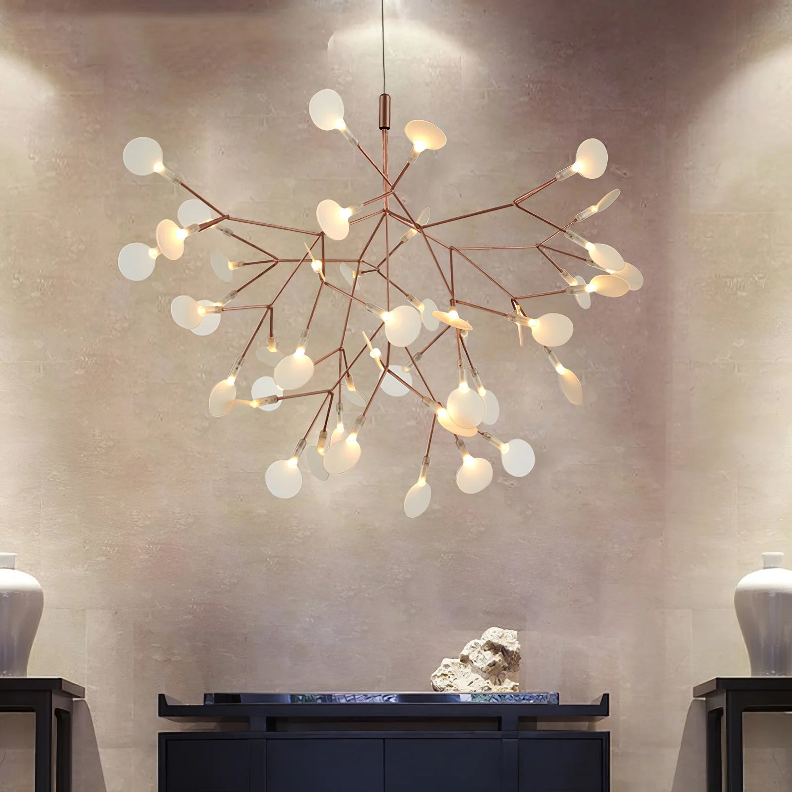 Illuminated branching chandelier in a furnished room