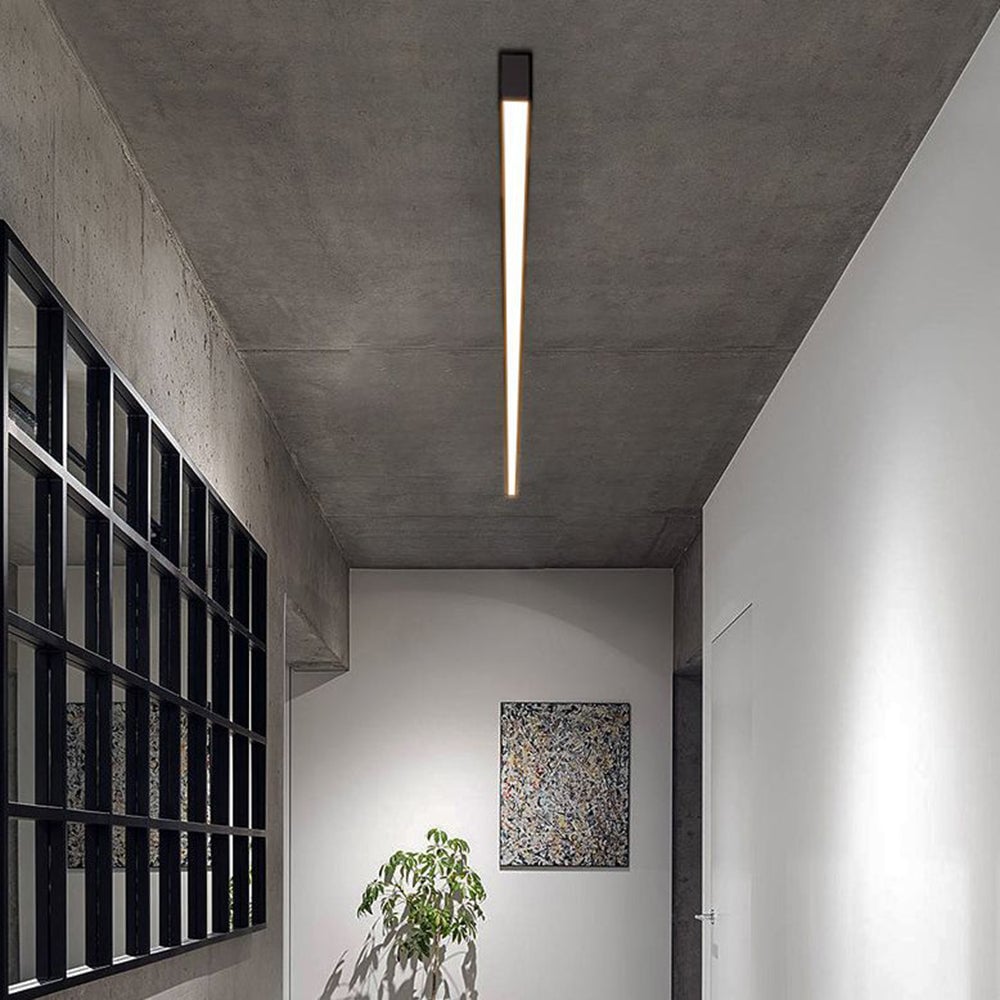 Single Edge light bar along a concrete-textured corridor ceiling