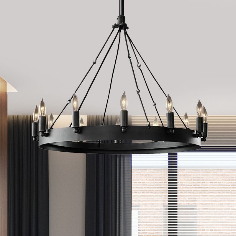 Alessio black wheel chandelier with exposed candle-shaped bulbs above the circular frame.