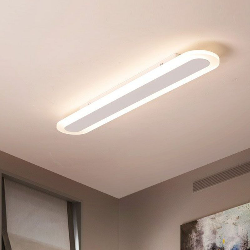 White Edge oval ceiling light against a pale ceiling