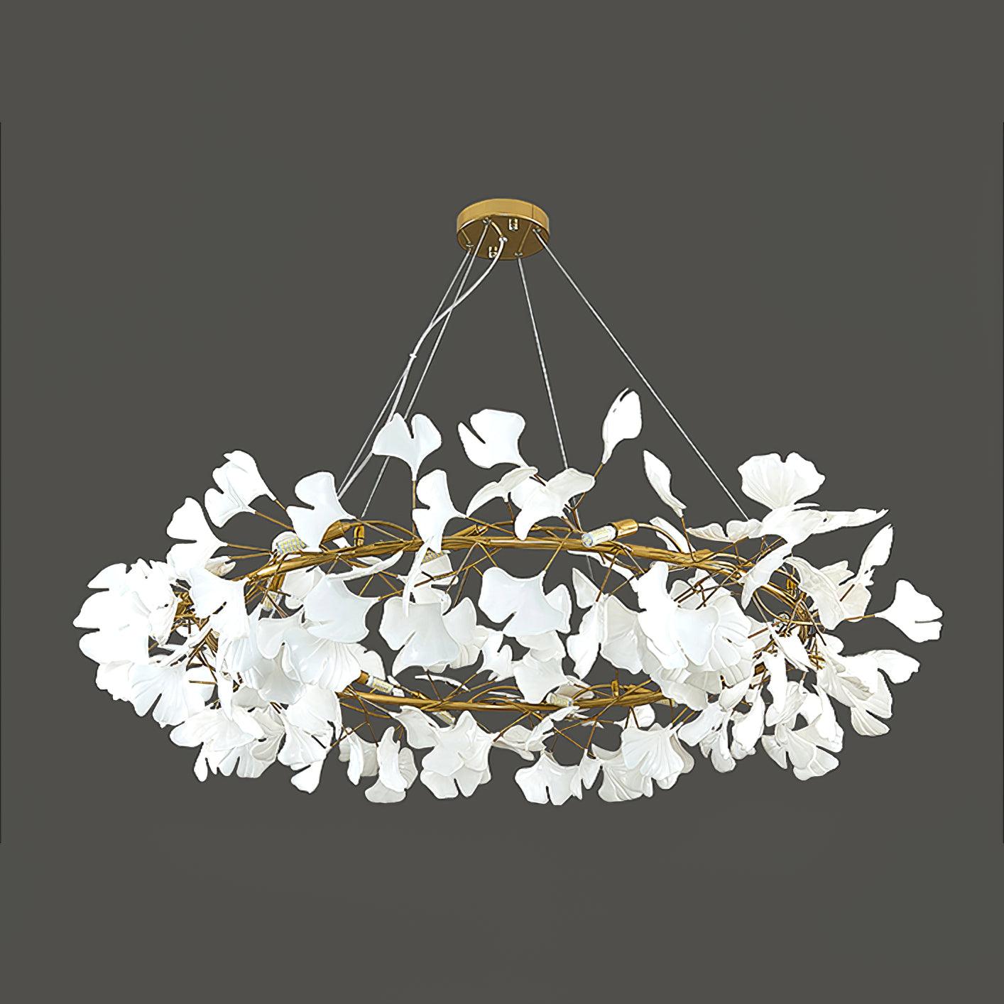 Unlit white ceramic leaves on a gold-colour chandelier frame