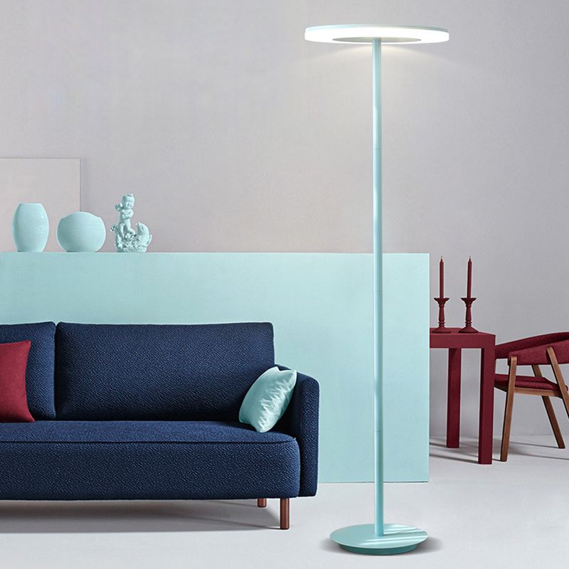 Morandi blue disc lamp beside a blue sofa