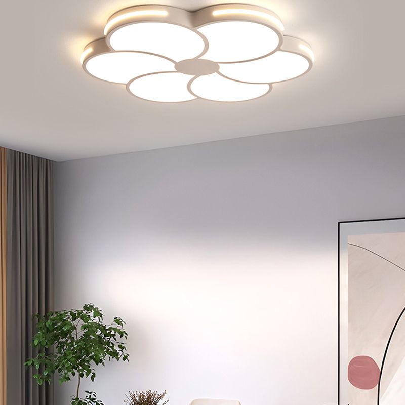 Warm glowing Hana flower light against a gray room ceiling