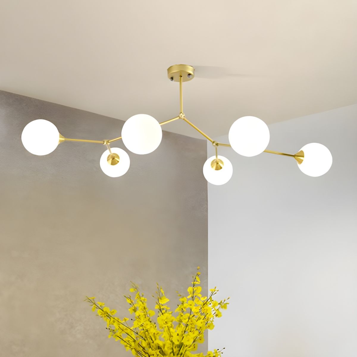 Six-globe gold-tone Valentina chandelier above a table