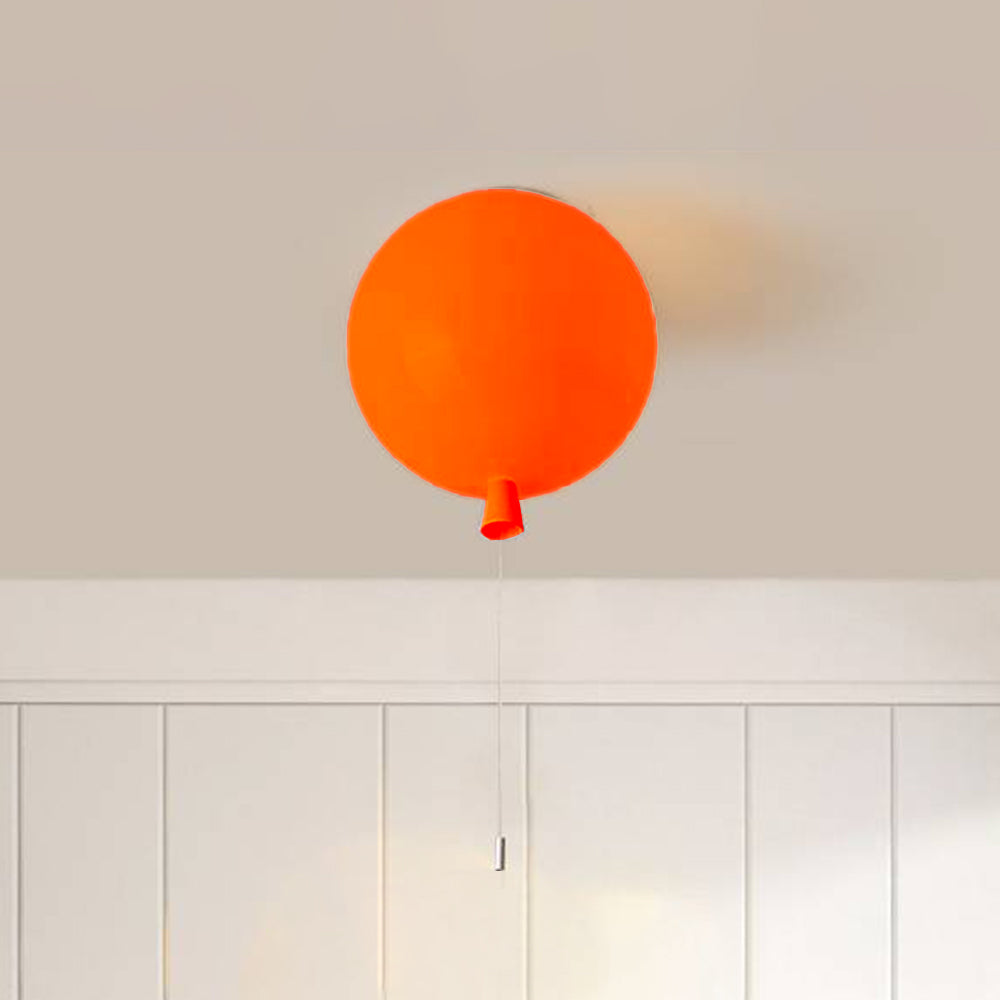 Orange Fateh balloon fitting against a pale ceiling, showing the rounded glossy shade and tapered lower neck detail.