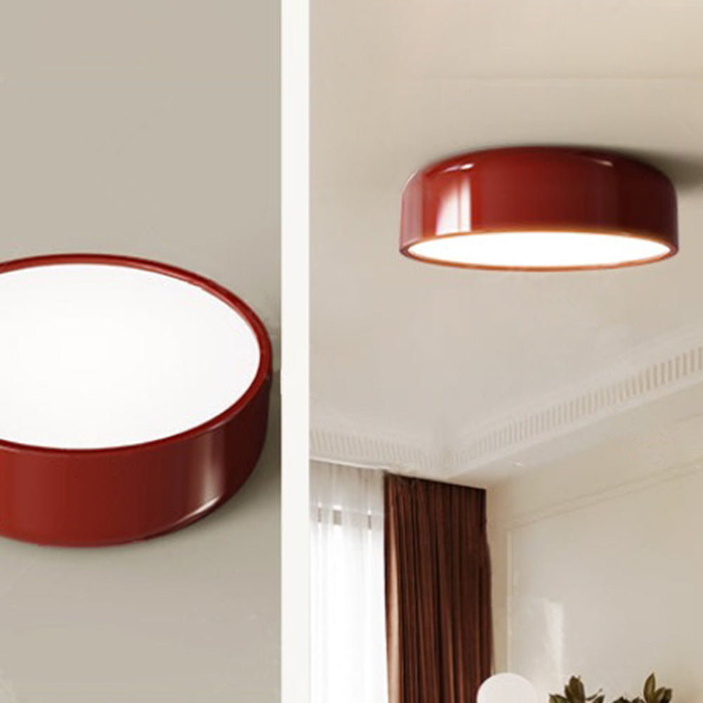 Red Morandi light shown from below and mounted near curtains