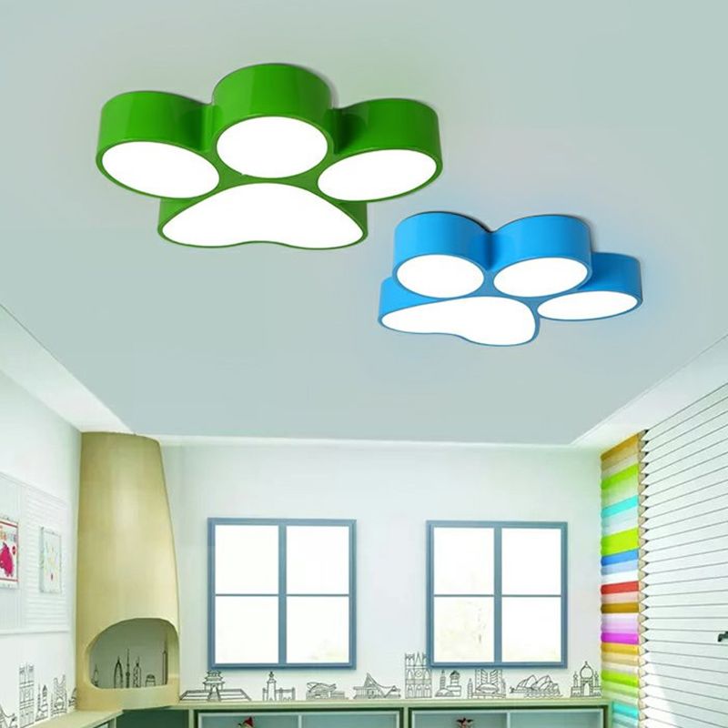 Green and blue Freja paw lights pictured on one room ceiling