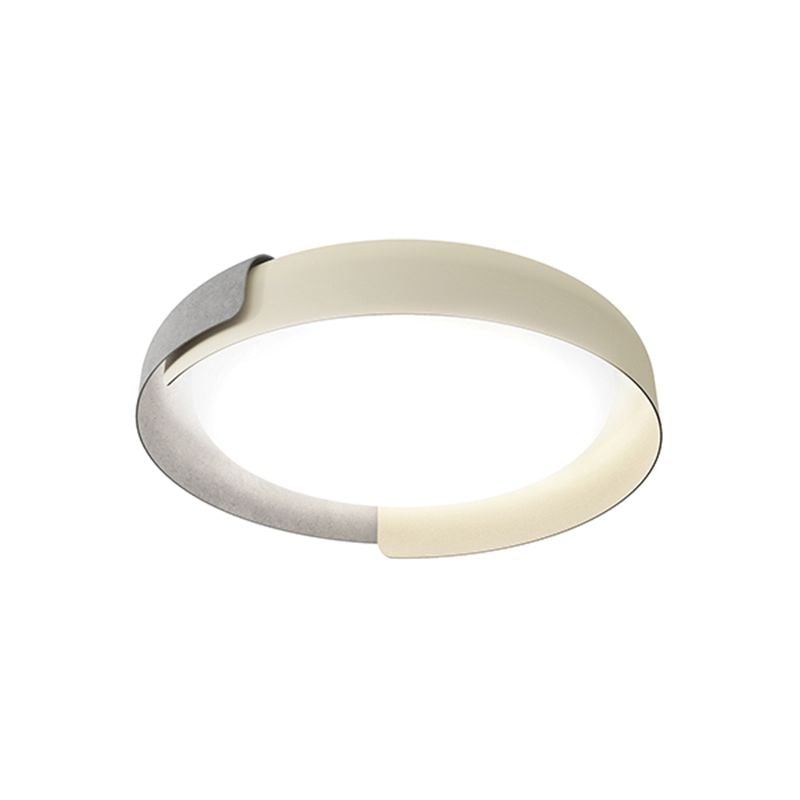 Quinn round filled pale light face on a white background, framed by gray and light curved bands with overlapping ends.