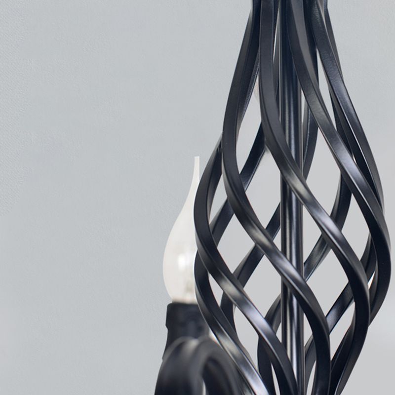 Detail of Black Silva twisted open metal central column, with a flame-shaped bulb partly visible behind