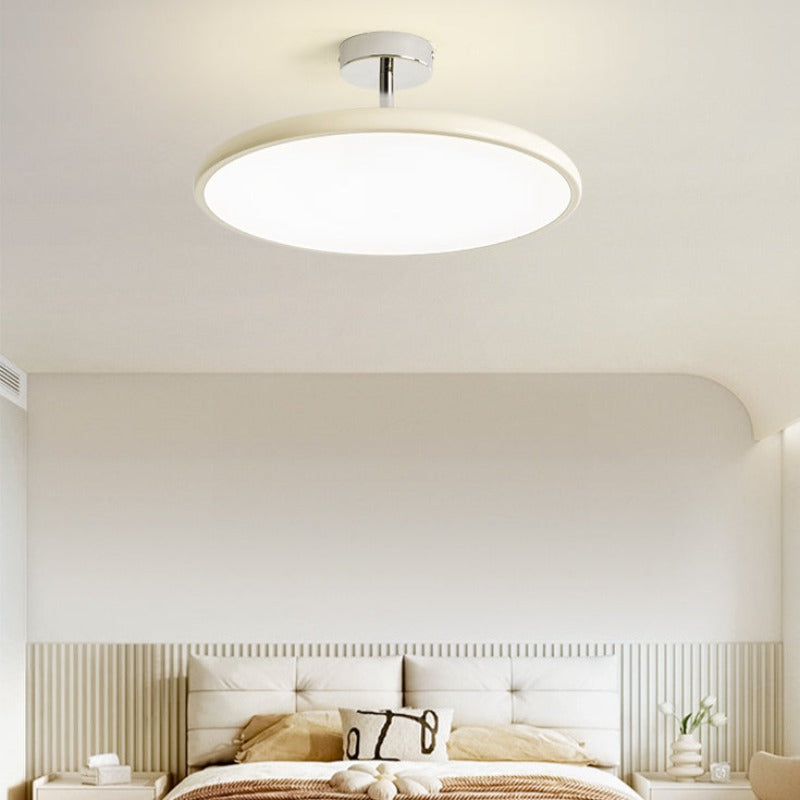 Cream Valentina ceiling light above a bedroom with pale bedding.