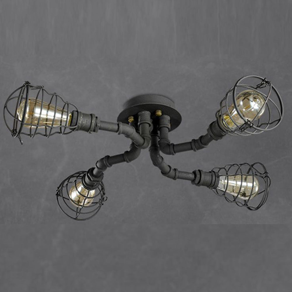 Four-light Alessio pipe-and-cage fixture against a gray ceiling