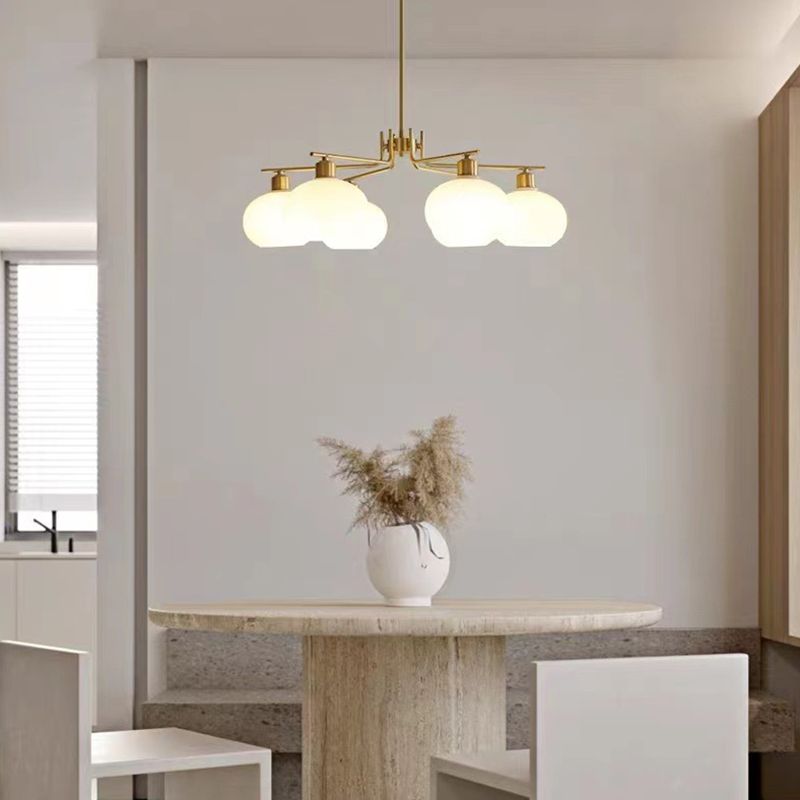 Valentina six-light brass-finish chandelier above a dining table