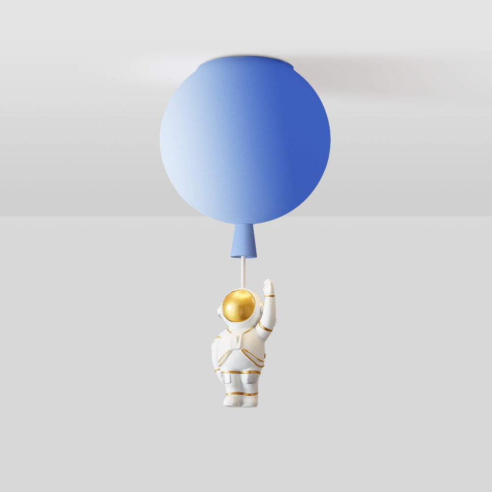 Cropped blue balloon globe at the ceiling with a tapered lower detail and a short pale link; the astronaut is outside the image.
