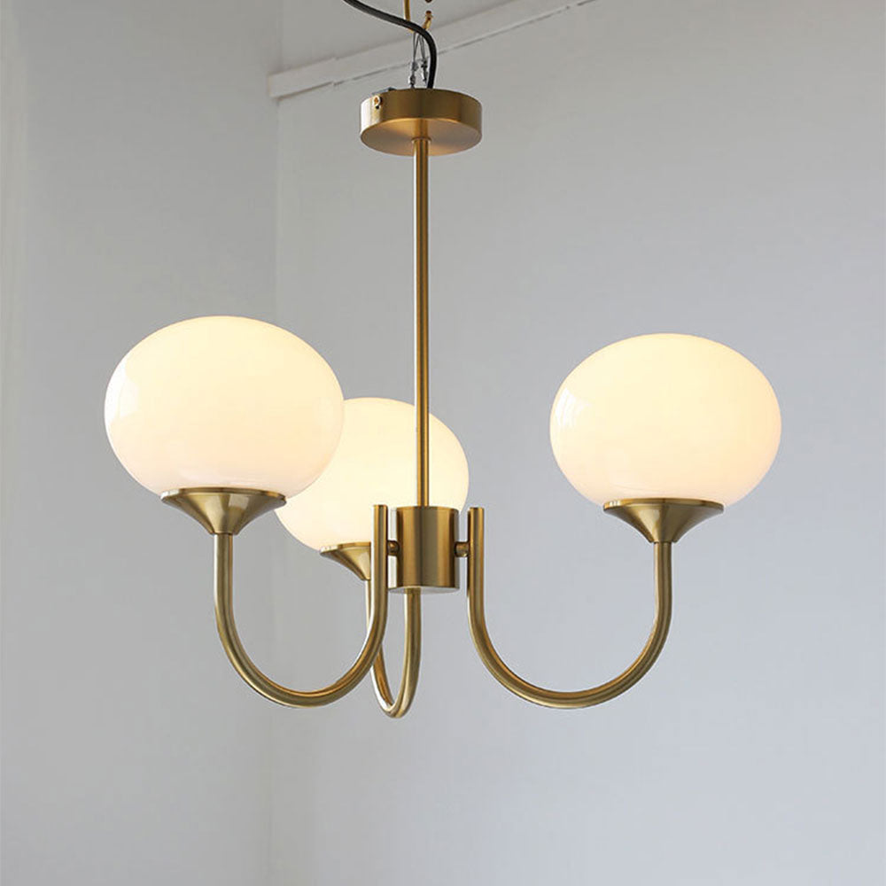 Three illuminated pale globes on a gold-coloured frame
