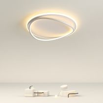 Illuminated white Quinn rings above a white dining table