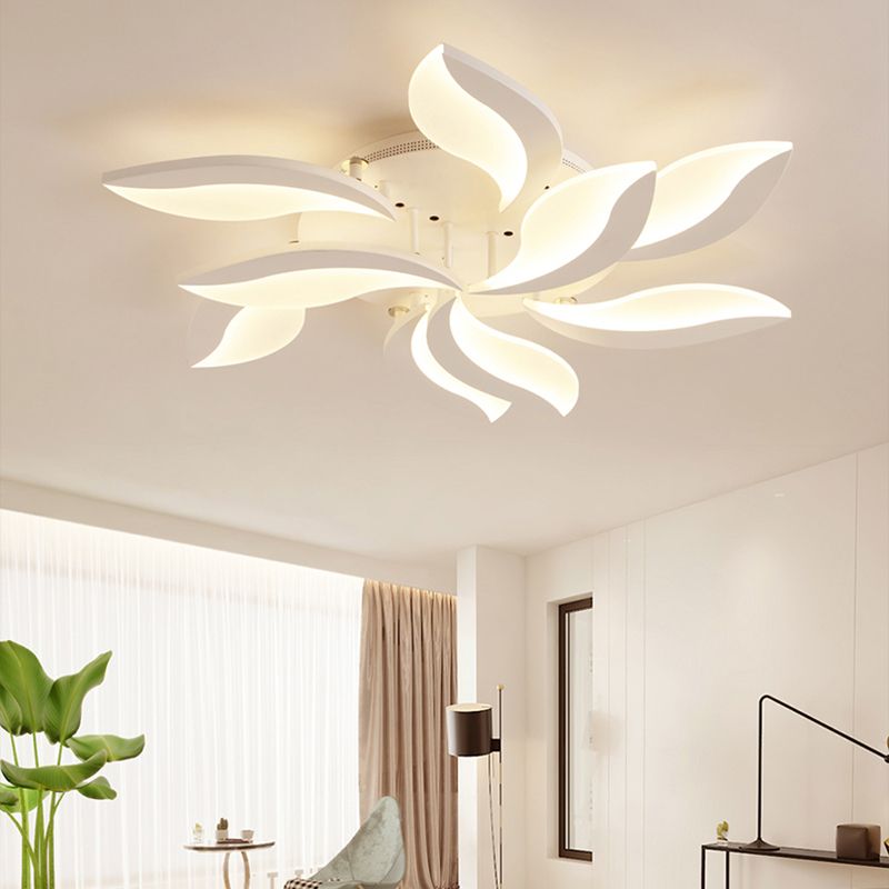 Hana illuminated leaf-petal fixture near curtains and a plant