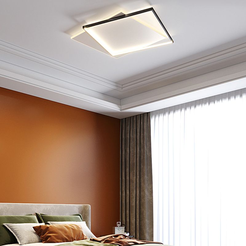 Quinn layered square ceiling light above olive bedding and brown cushions, with a terracotta bedroom wall and grey curtains.