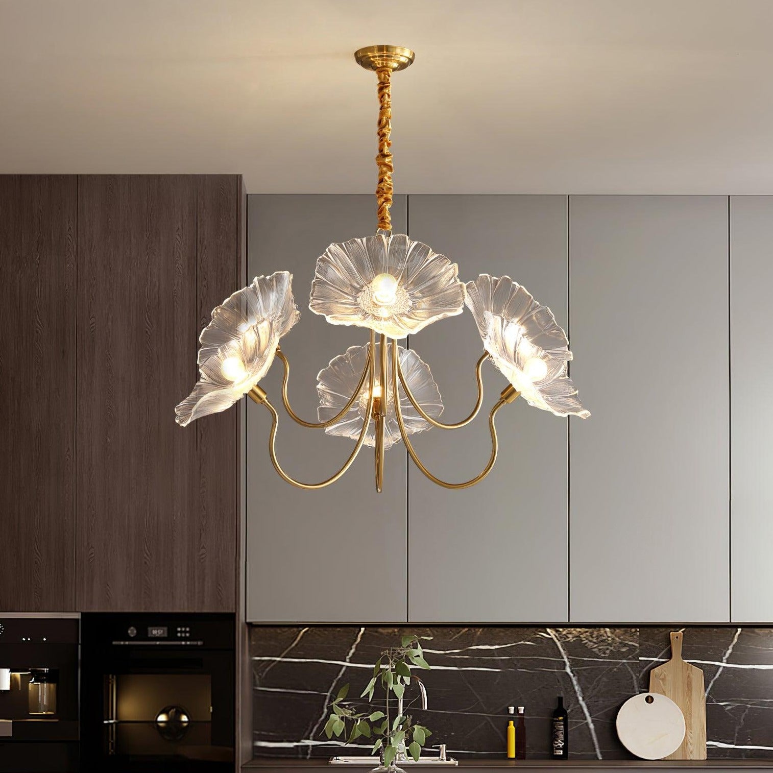 Clear flower chandelier above kitchen area