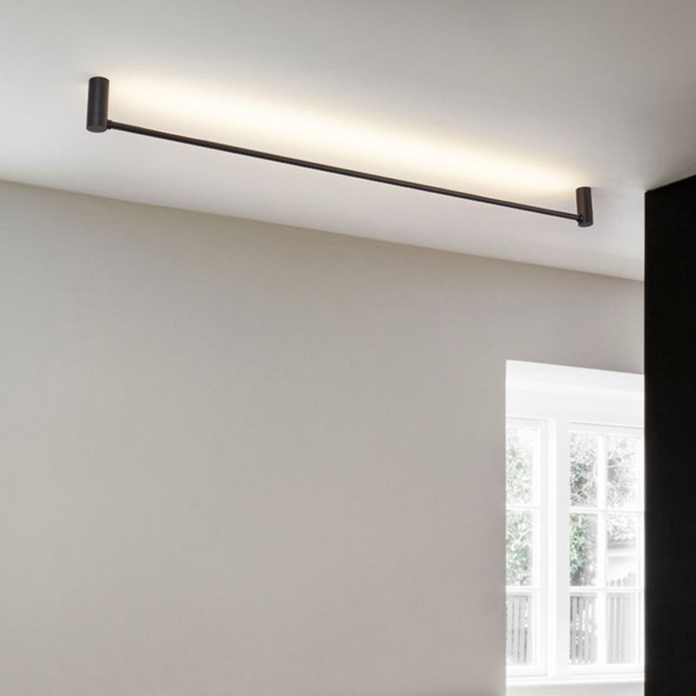 Angled Edge bar near the ceiling beside a beige wall, white multi-pane window and black curtain.
