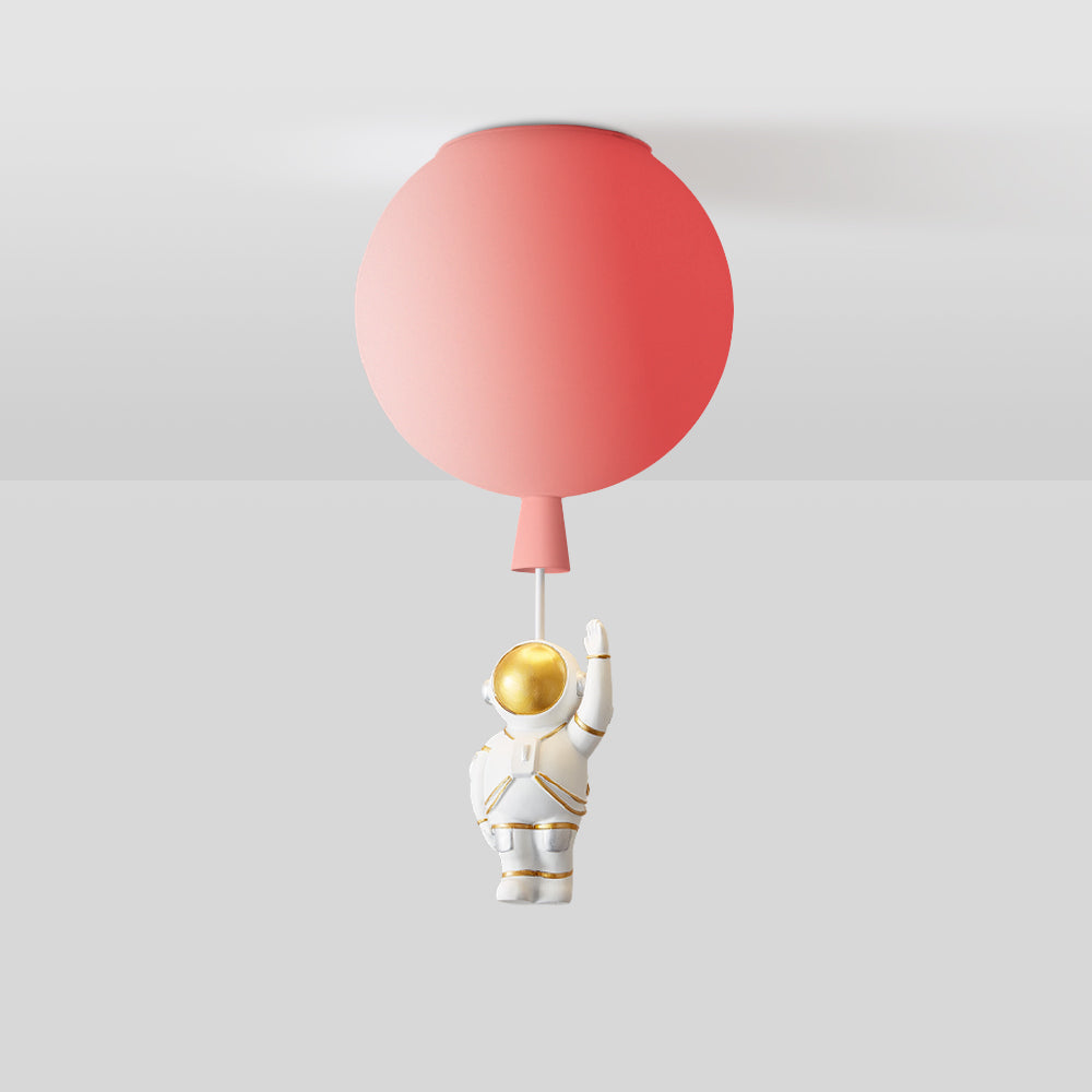 Cropped red balloon globe at the ceiling with a tapered lower detail and a short pale link; the astronaut is outside the image.