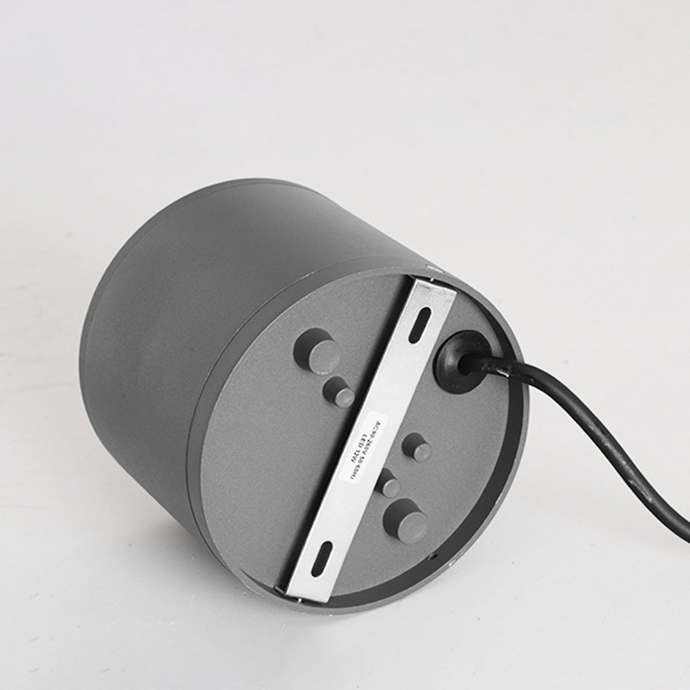 Rear of Orr showing a round base, slotted metal mounting strip, visible fasteners and cable entering through a round gland.