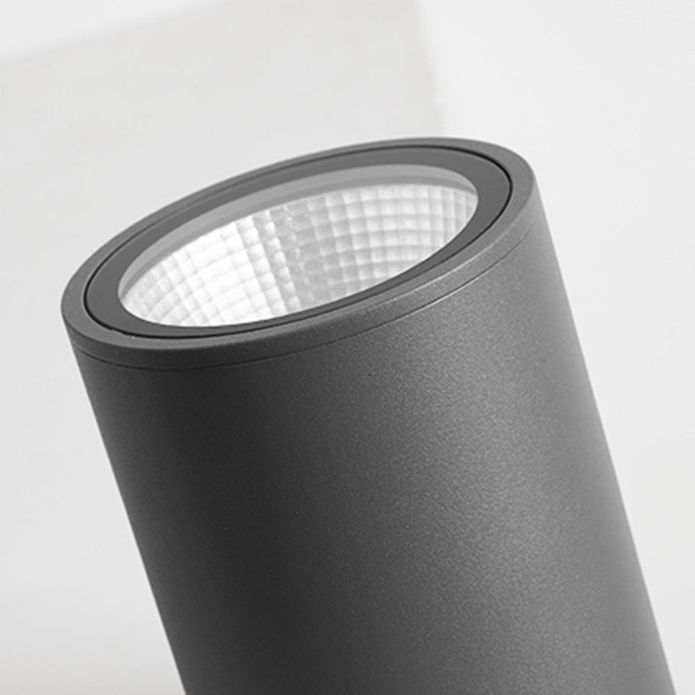 Tilted close-up of Orr black cylindrical sidewall, circular trim and recessed pale faceted reflector.