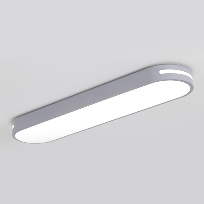Gray Quinn capsule ceiling light with a bright slot near the rounded end and a filled bright lower face.