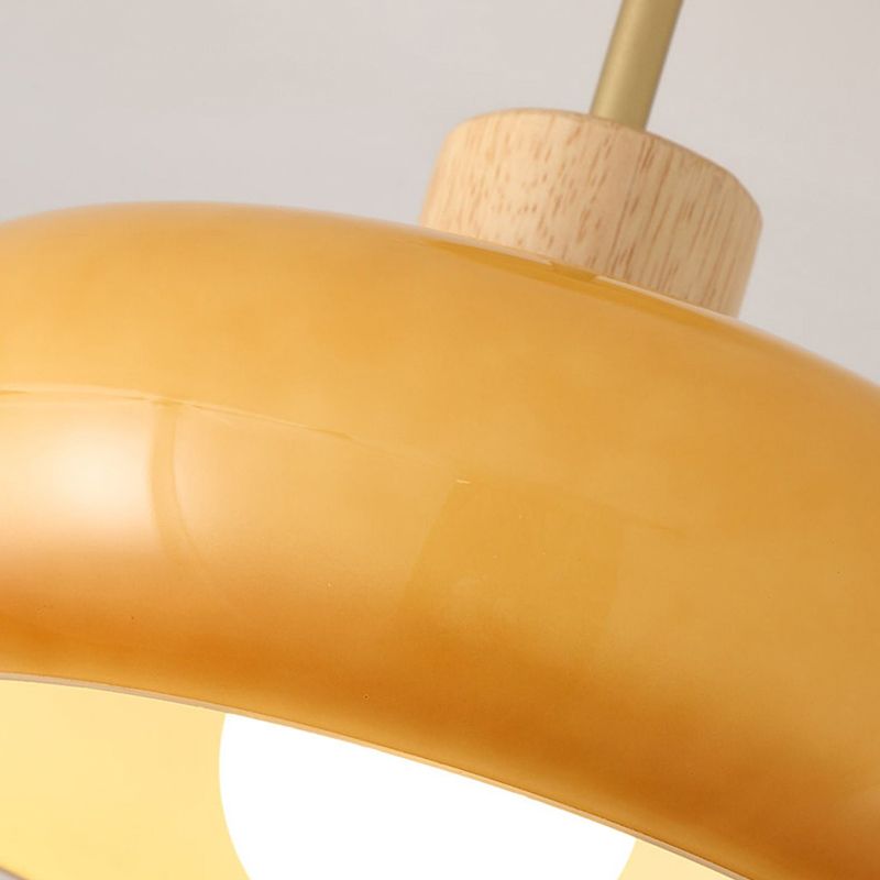 Close view of Hailie orange glass dome and wood collar