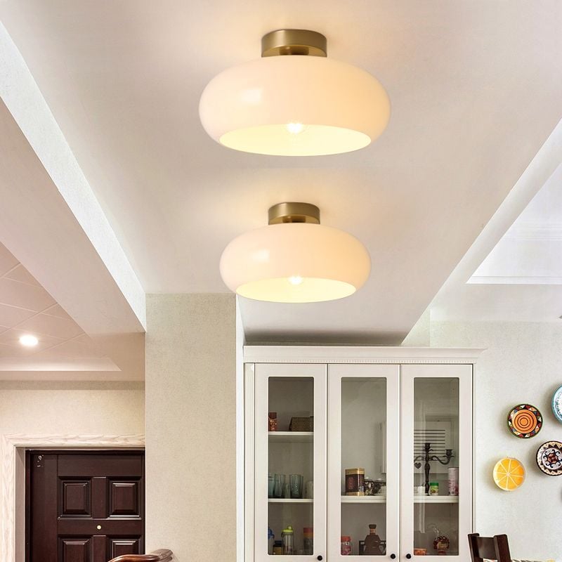 Two white Hailie Style A dome lights along a ceiling
