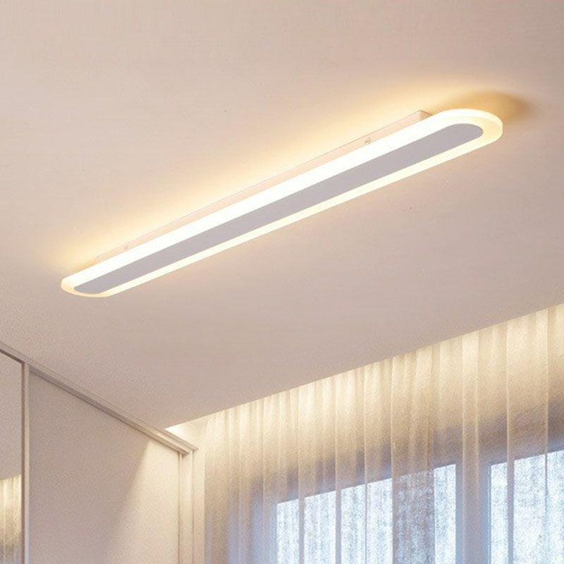 White Edge ceiling fixture above curtains in a bright room