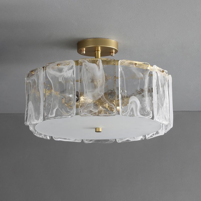 Unlit-looking Kirsten glass-panel shade with white swirls and gold-coloured flecks, gold-toned canopy and pale bottom plate.