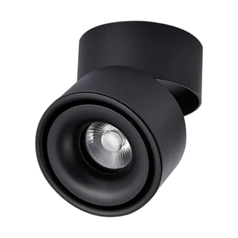 Close front view of the black Novak spotlight lens, round head and mounting base.