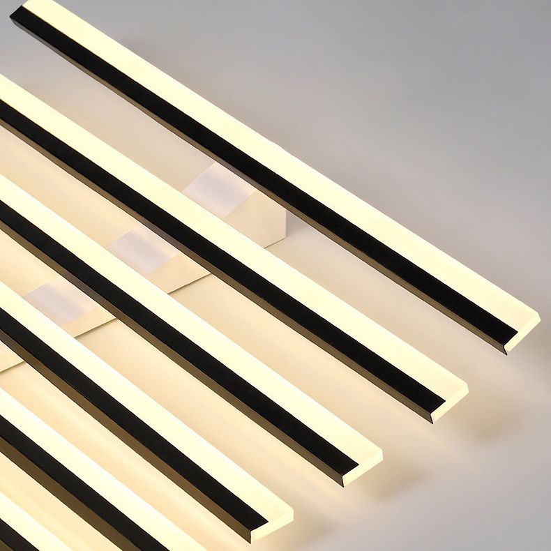 Quinn close-up of staggered black-edged light bars, pale illuminated faces and rectangular mounting parts behind them.