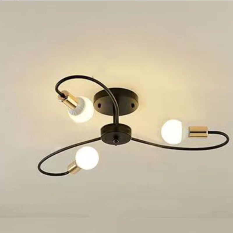 Valentina Black three-loop ceiling light seen from below, showing gold-tone holders and round lit bulbs.